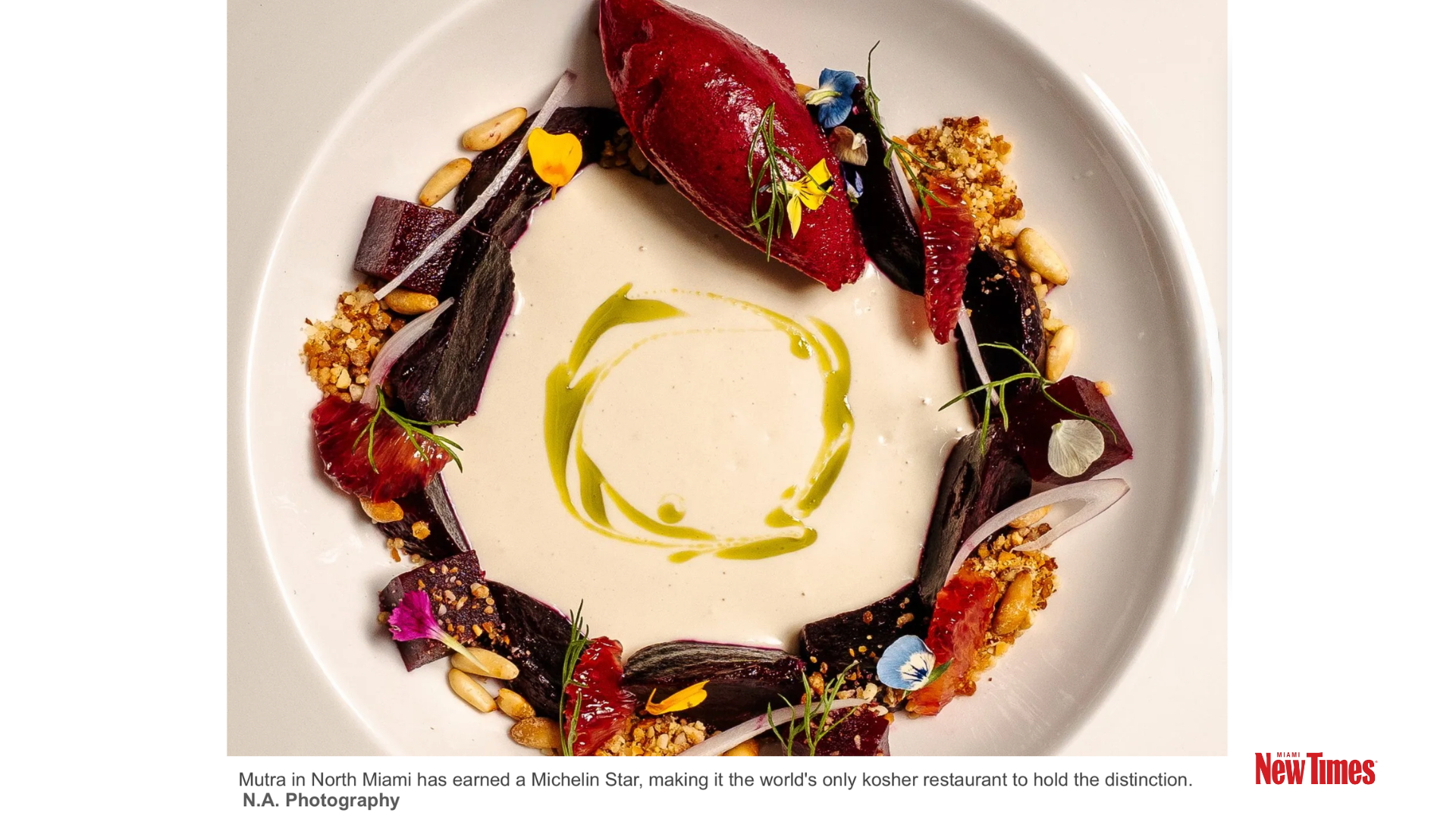 A composed restaurant dish with beets, red sorbet, citrus, pine nuts, herbs, and edible flowers on a white plate.